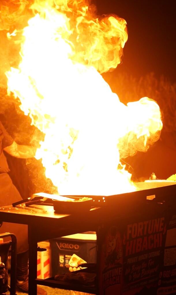 Large fireball rising from the hibachi grill at night