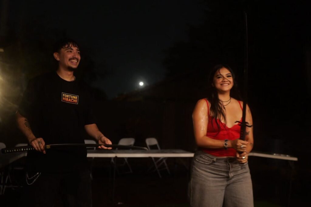 Fortune Hibachi chef and guest during an outdoor party