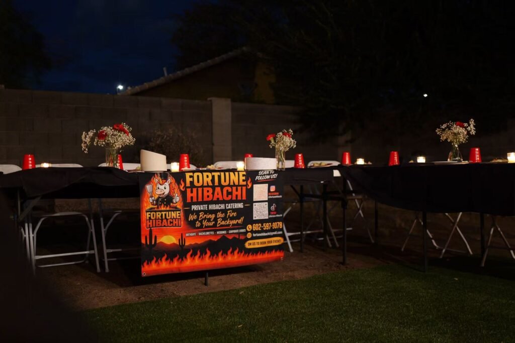 Fortune Hibachi backyard dinner setup with flowers and candles